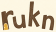 Rukn logo — brown wordmark with a golden door